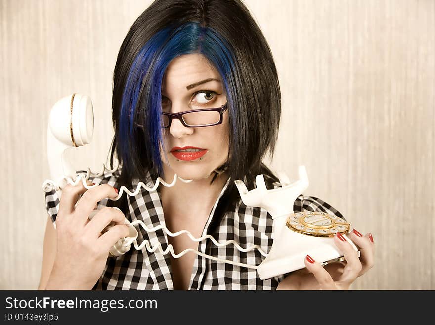 Apprehensive young wrapped in a vintage phone cord. Apprehensive young wrapped in a vintage phone cord