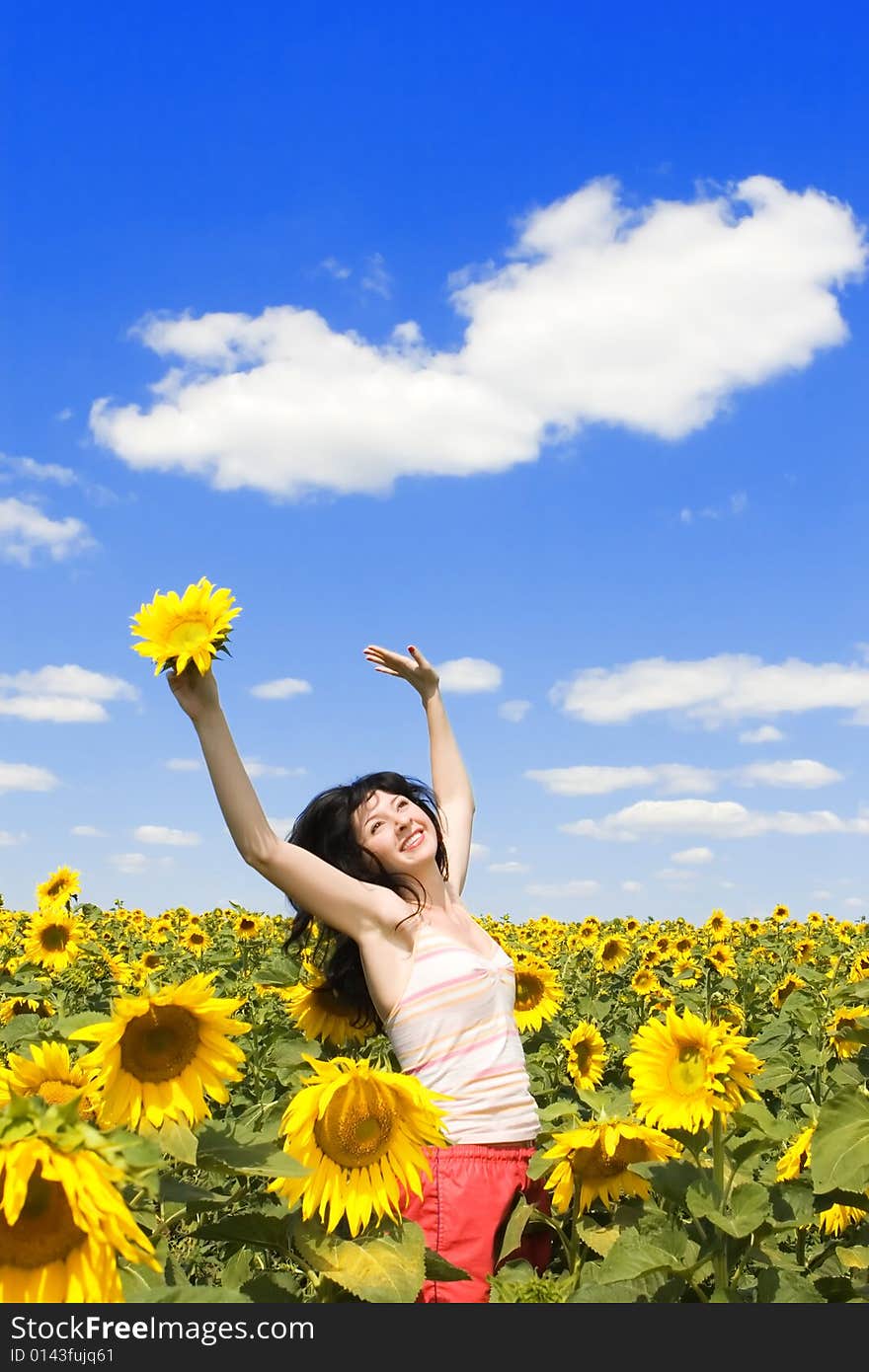 Woman in the field of sunflowers