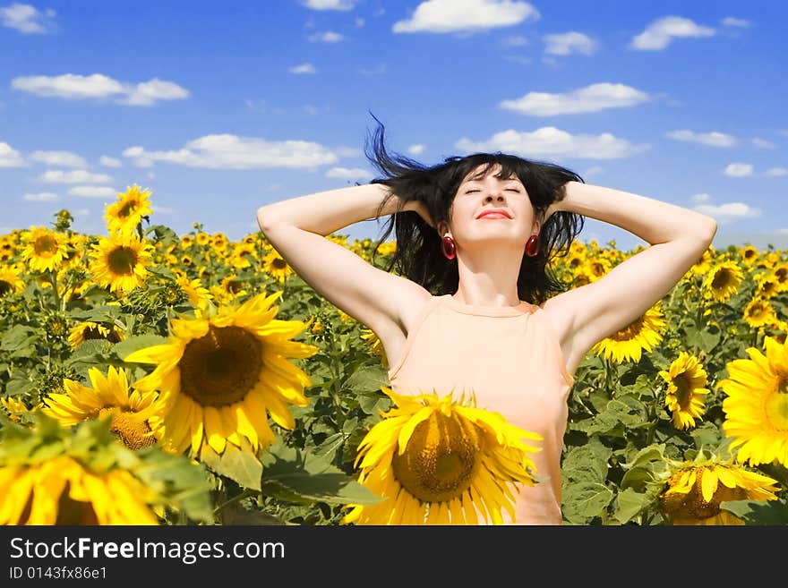 Woman in the field of sunflowers