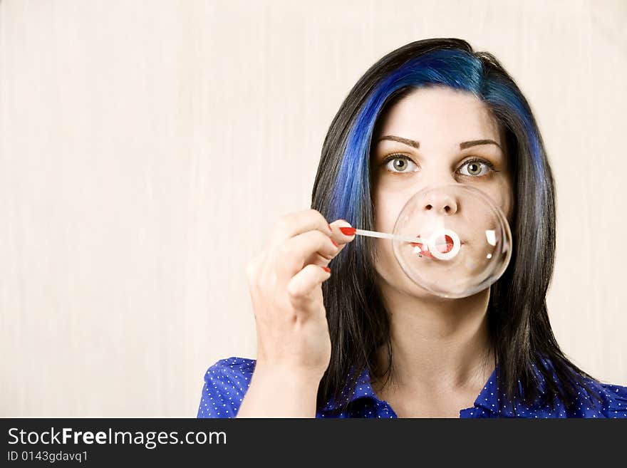 Pretty with Pretty Eyes Woman Blowing a Large Bubble. Pretty with Pretty Eyes Woman Blowing a Large Bubble