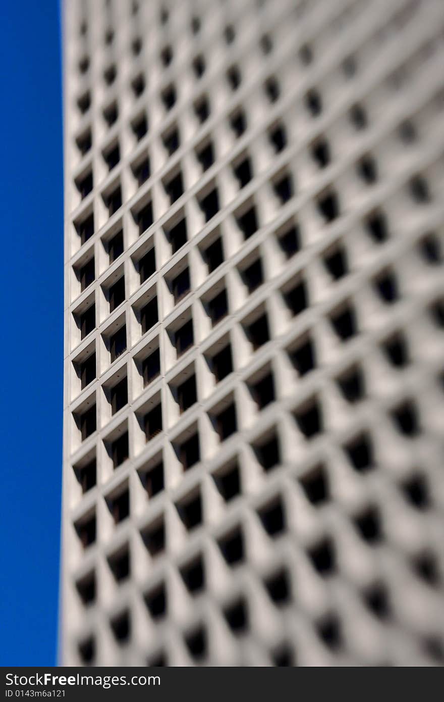 Modern office building against blue sky