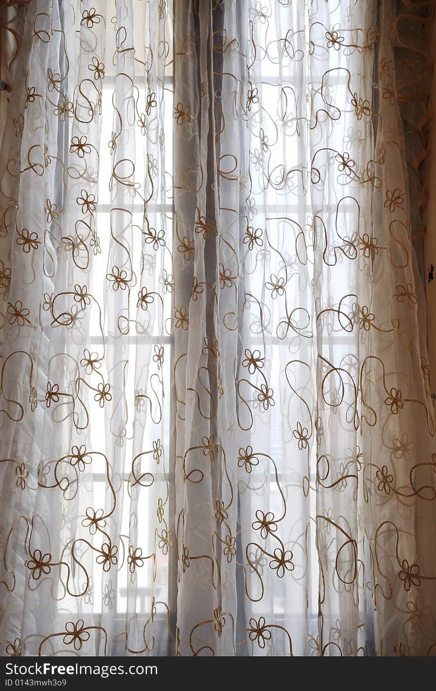 The soft voile curtain with flower pattern.