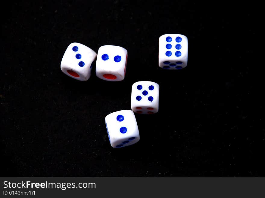 Five Dices On The Black Background.