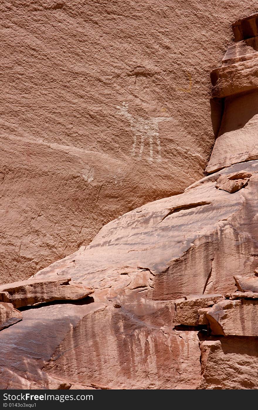 An image of carvings and ancient art on canyon walls