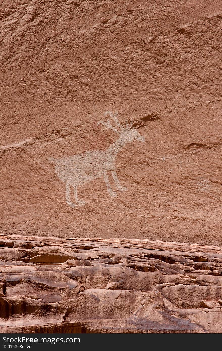 An image of carvings and ancient art on canyon walls