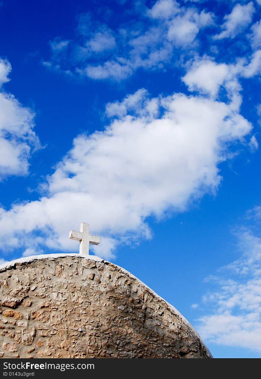 View of an old christian church in Cyprus against a blue cloudy sky. View of an old christian church in Cyprus against a blue cloudy sky