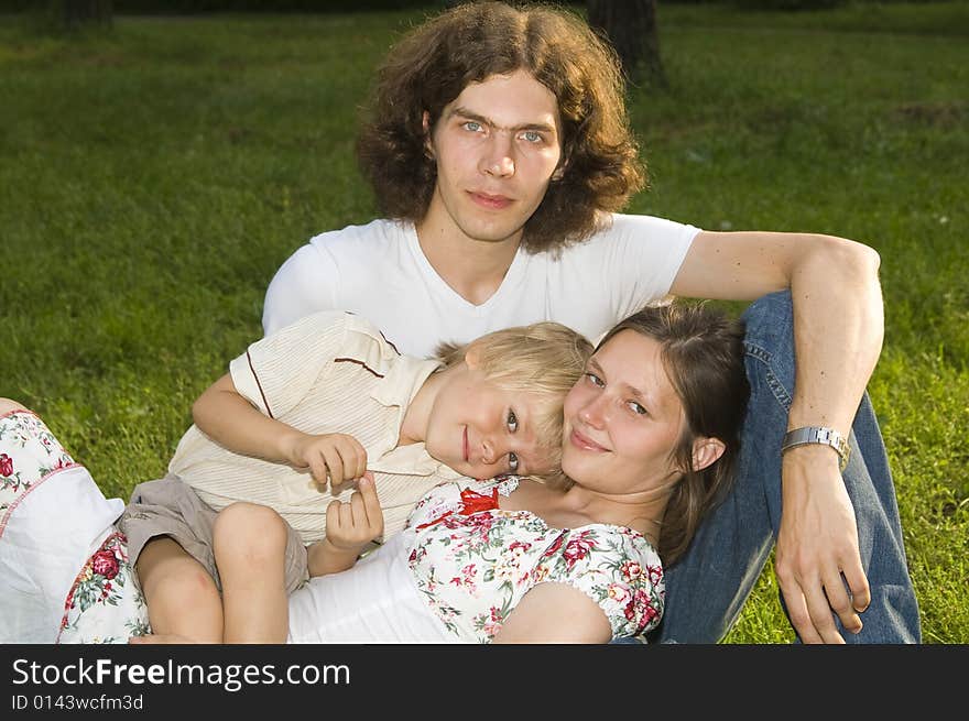 Happy Family In Nature S Lap