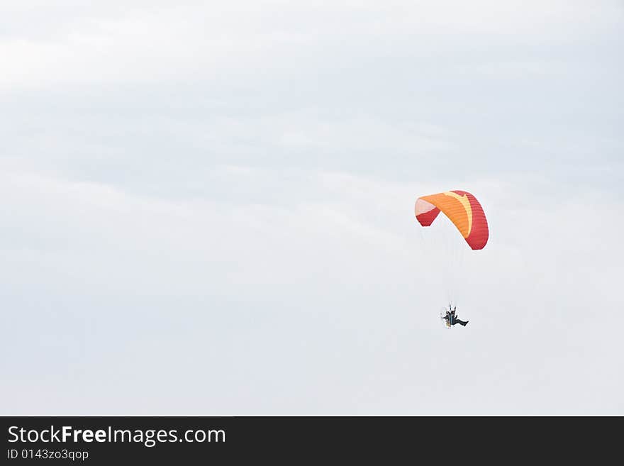 Single paraglider on a cloudy day - landscape exterior