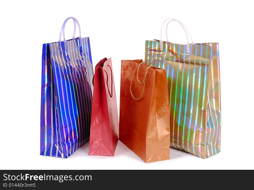 Group of colorful shopping bags over white background