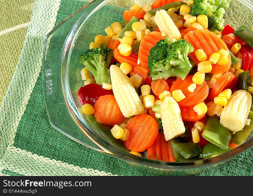 Cooked carrots sweet corn and broccoli on plate. Cooked carrots sweet corn and broccoli on plate