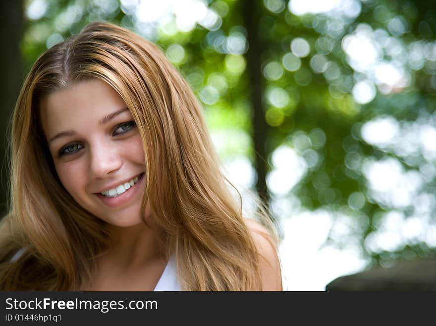 Portrait of young girl on forest background