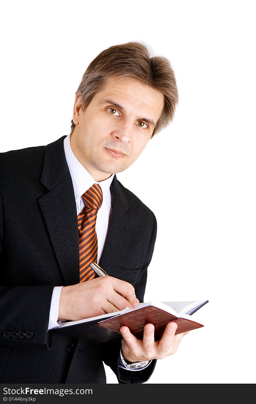 Businessman writing something in his notebook. Businessman writing something in his notebook