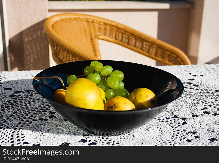 Ripe fruits in the black dish