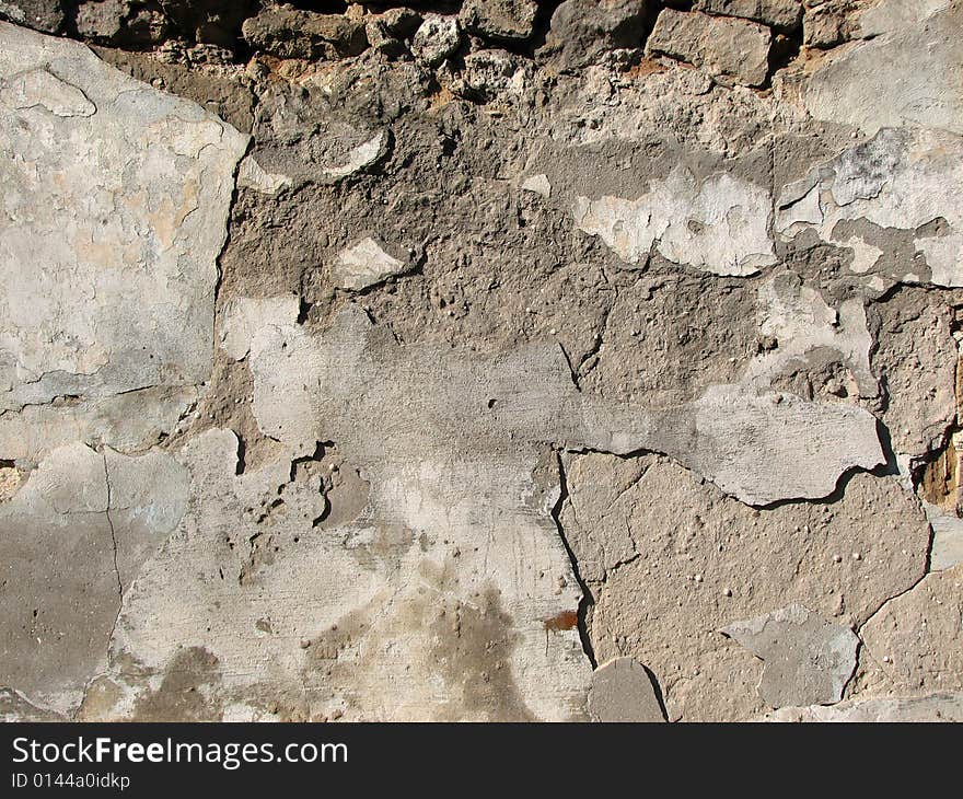 Grunge cracked old stone wall. Grunge cracked old stone wall