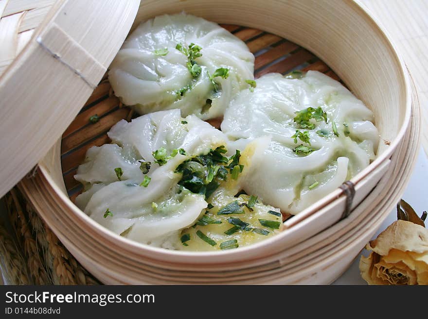 Some asian leak-balls in a wooden bowl. Some asian leak-balls in a wooden bowl