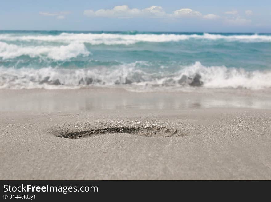 Close up of footprint on sand beach