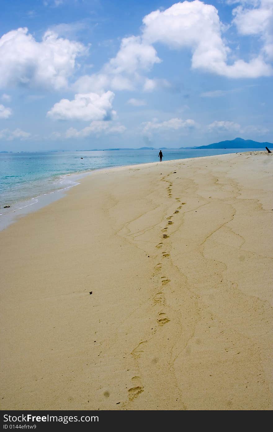 Beach from the yellow sand under the dark-blue sky on the island in the Indian Ocean. Beach from the yellow sand under the dark-blue sky on the island in the Indian Ocean