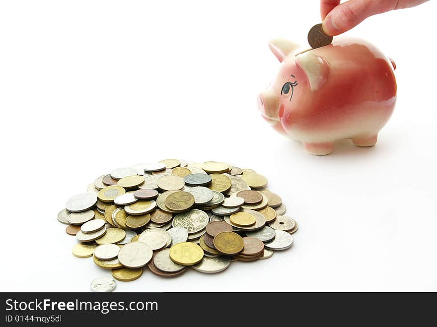 Pink piggy bank  isolated on white background with coins. Pink piggy bank  isolated on white background with coins