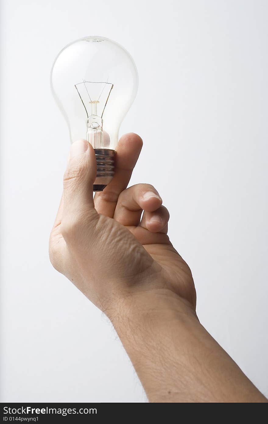 Human hand and light bulb isolated over white