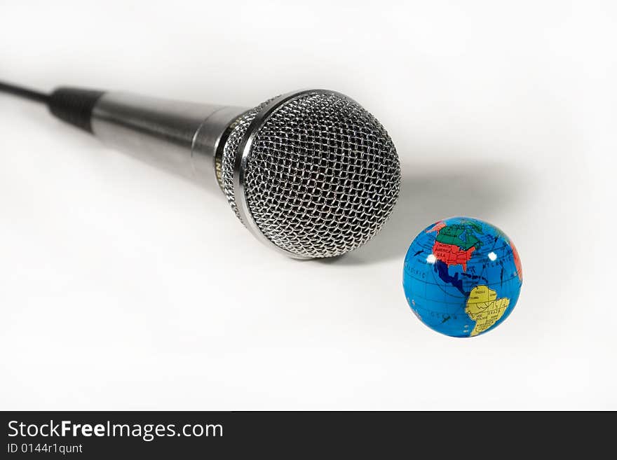 Microphone And A Small Globe