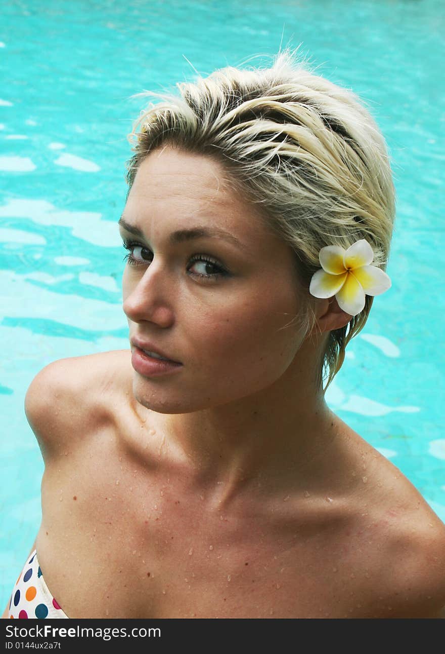 Beautiful blond woman in a swimming pool.