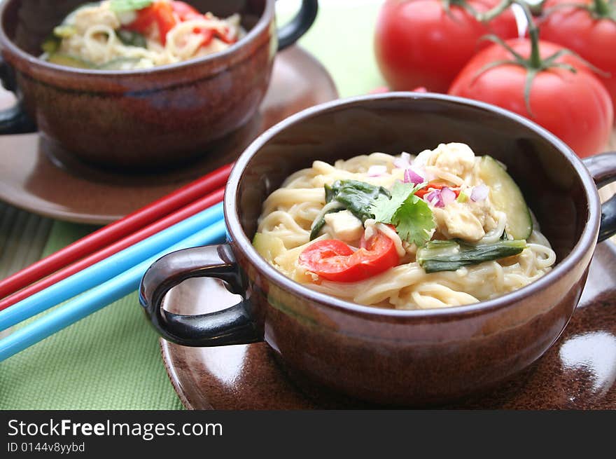 A asian meal with noodles, vegetables and tofu. A asian meal with noodles, vegetables and tofu