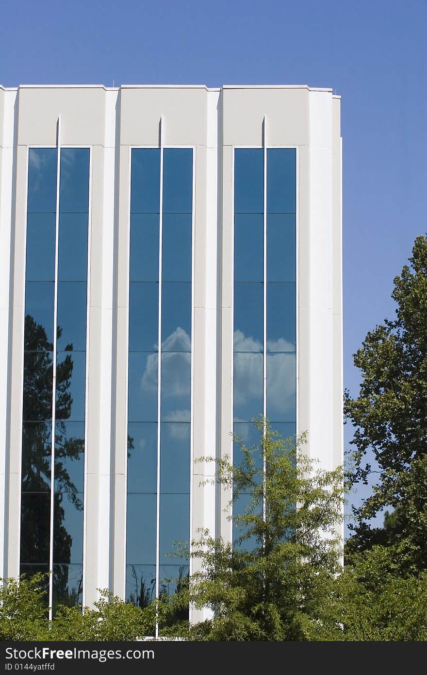 Clouds Reflected in White Building