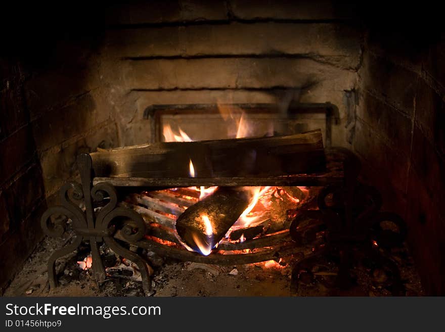 Old fireplace and a fire