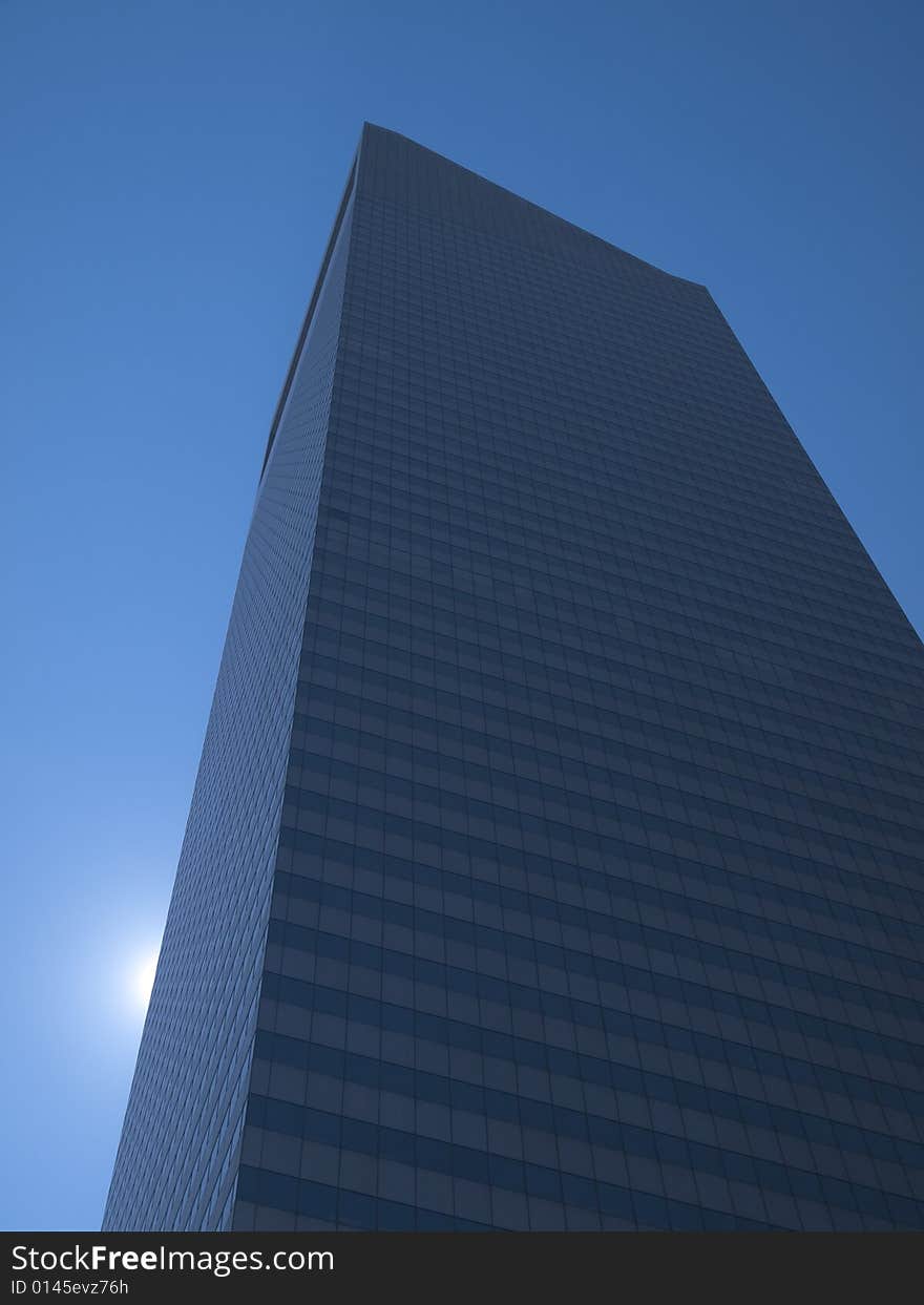 High modern skyscraper on a background of a blue sky and the sun. High modern skyscraper on a background of a blue sky and the sun.