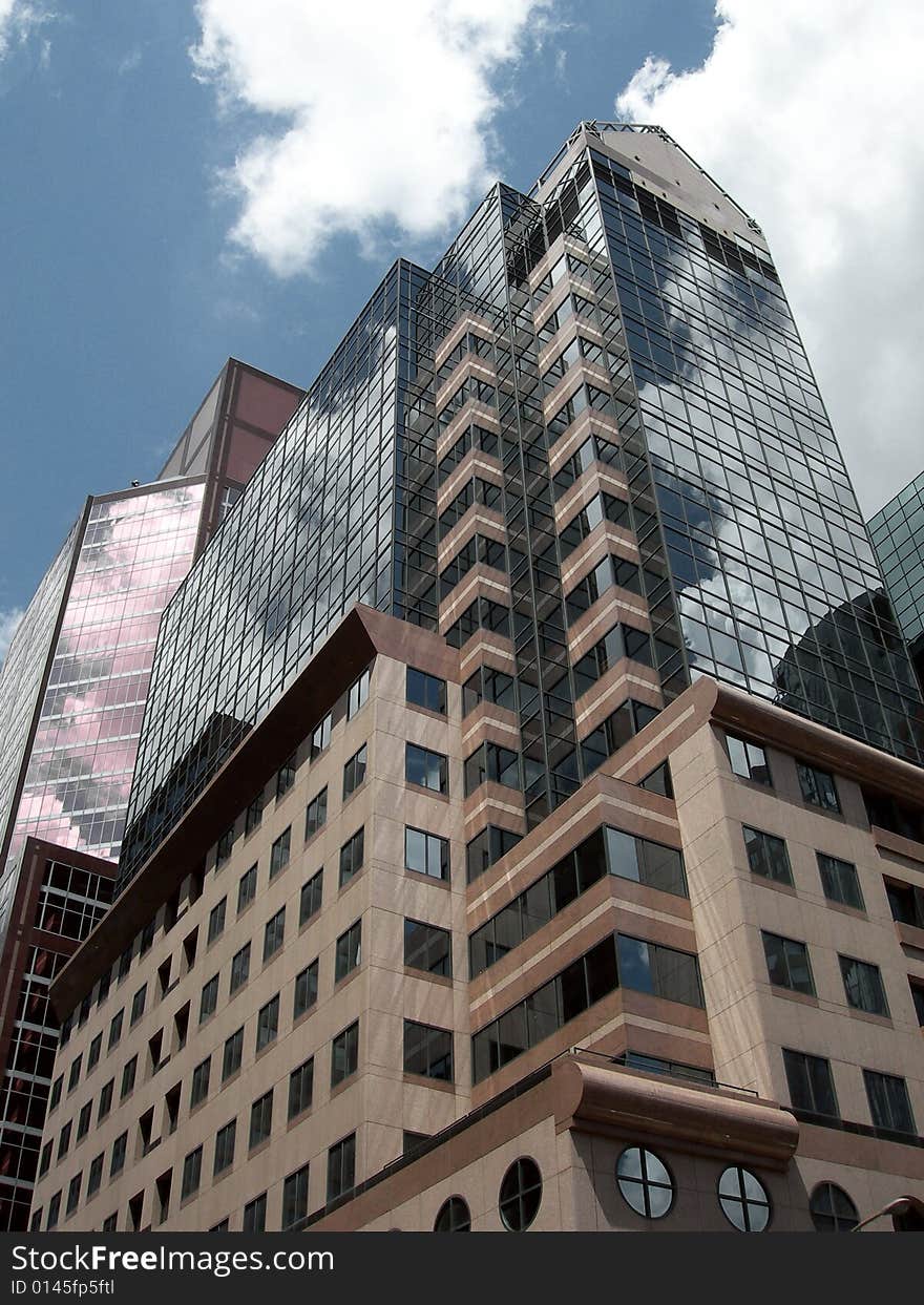 Glass building with sky reflect