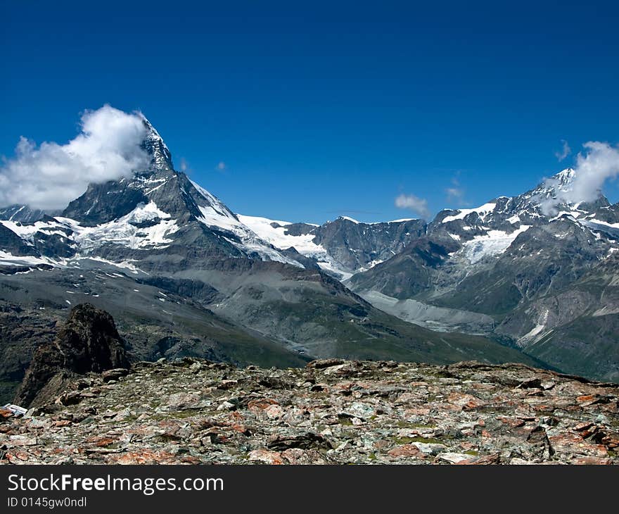 Matterhorn (Monte Cervino) is one of the highest summits from Europe (4478 m altitude). The mountain derives its name from the German words Matte, meaning meadow, and Horn, which means peak. On the border between Switzerland and Italy, it towers over the Swiss village of Zermatt and the Italian village Breuil-Cervinia in the Val Tournanche. Matterhorn (Monte Cervino) is one of the highest summits from Europe (4478 m altitude). The mountain derives its name from the German words Matte, meaning meadow, and Horn, which means peak. On the border between Switzerland and Italy, it towers over the Swiss village of Zermatt and the Italian village Breuil-Cervinia in the Val Tournanche.