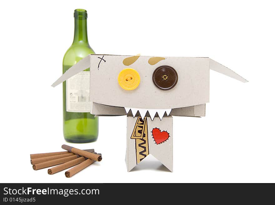 Wine bottle, cigarettes and freaky cardboard toy. Wine bottle, cigarettes and freaky cardboard toy