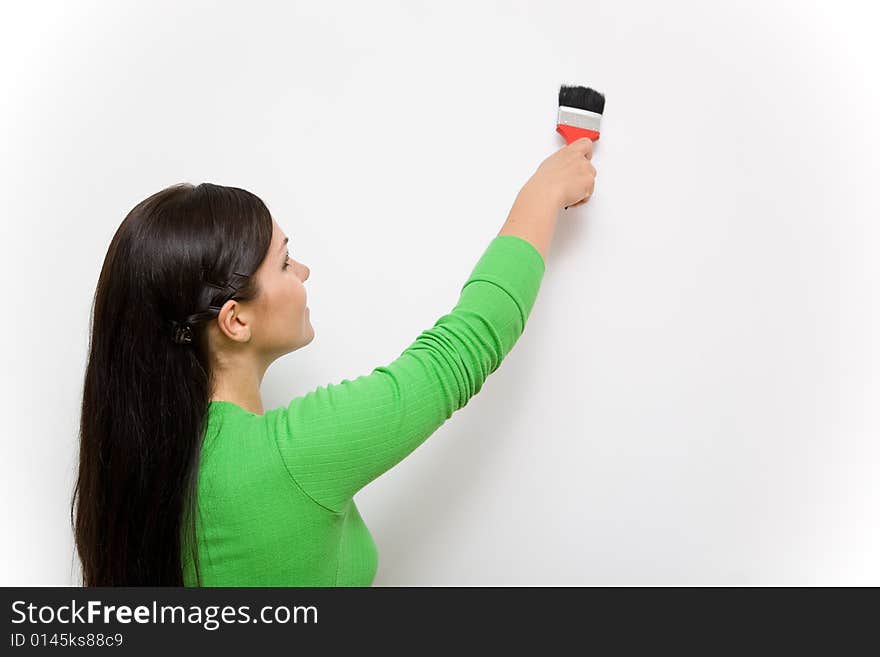 Casual woman happy with paintbrush. Casual woman happy with paintbrush