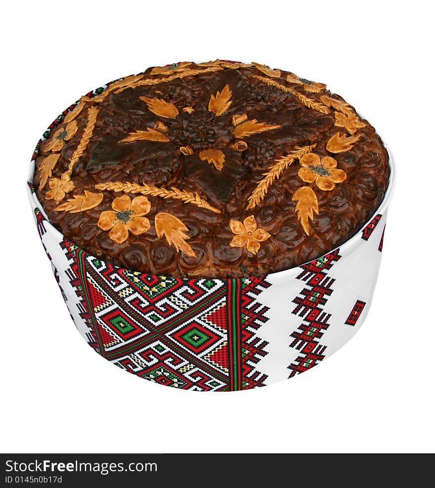 Traditional celebratory Ukrainian loaf on a white background