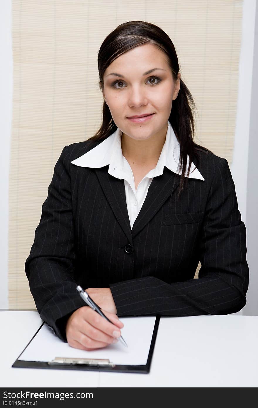 Happy and attractive brunette businesswoman