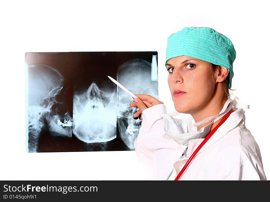 A young female doctor with a x-ray in the background and a stethoscope around the neck!. A young female doctor with a x-ray in the background and a stethoscope around the neck!