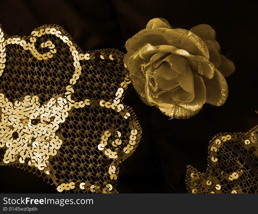 Gold rose and diamantes on black cloth