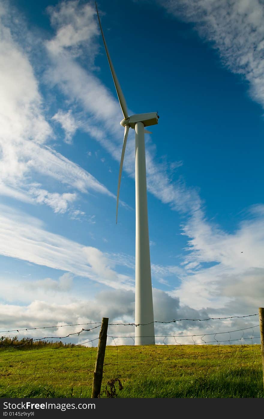 Beautiful green meadow with Wind turbines generating electricity. Beautiful green meadow with Wind turbines generating electricity