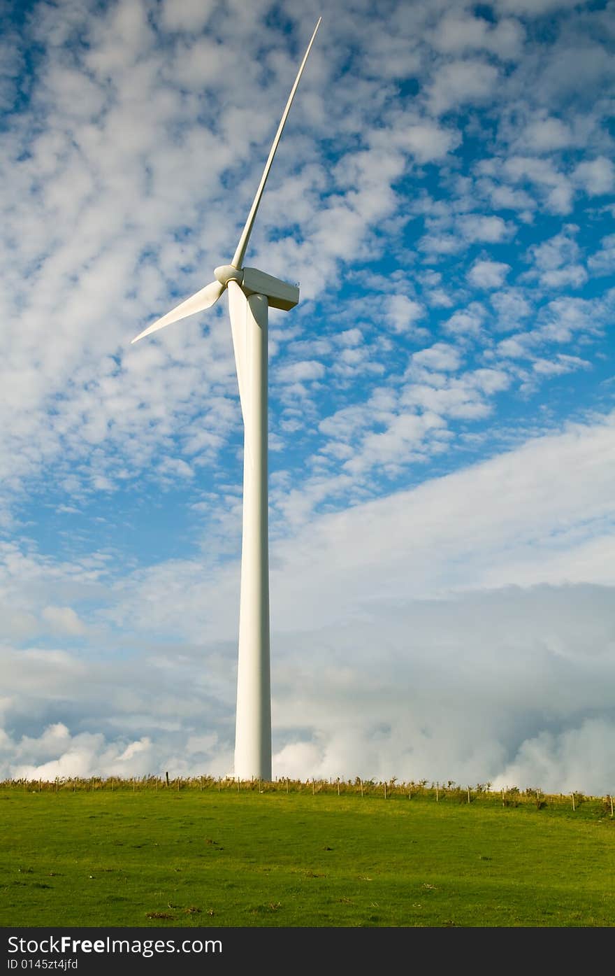 Beautiful green meadow with Wind turbines generating electricity. Beautiful green meadow with Wind turbines generating electricity