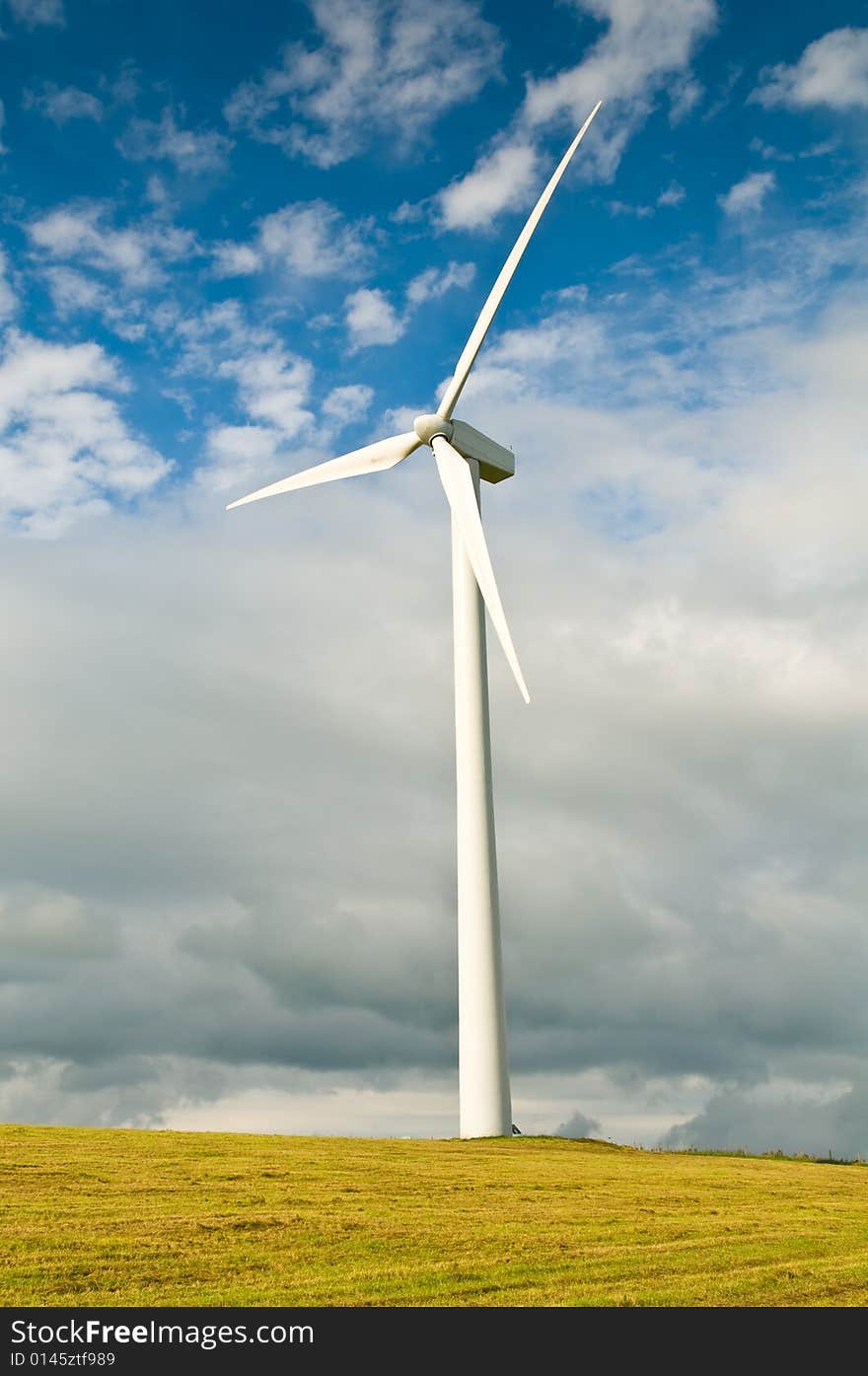 Beautiful green meadow with Wind turbines generating electricity. Beautiful green meadow with Wind turbines generating electricity