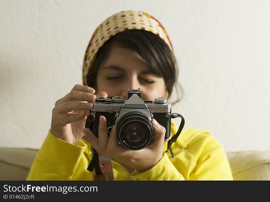 Girl looking at her camera. Horizontally framed photo. Girl looking at her camera. Horizontally framed photo.