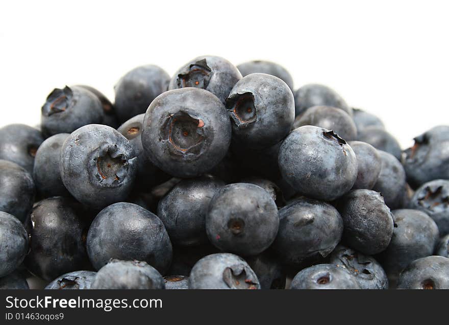 A group of blueberries isolated with a white background. A group of blueberries isolated with a white background.