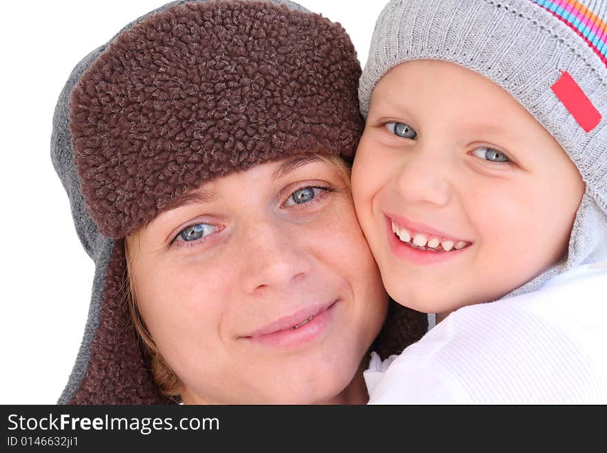 Mother and son in caps - autumn portrait. Mother and son in caps - autumn portrait