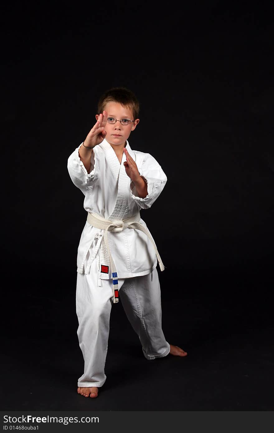 Traditional karate student demonstrating handblock and right stance