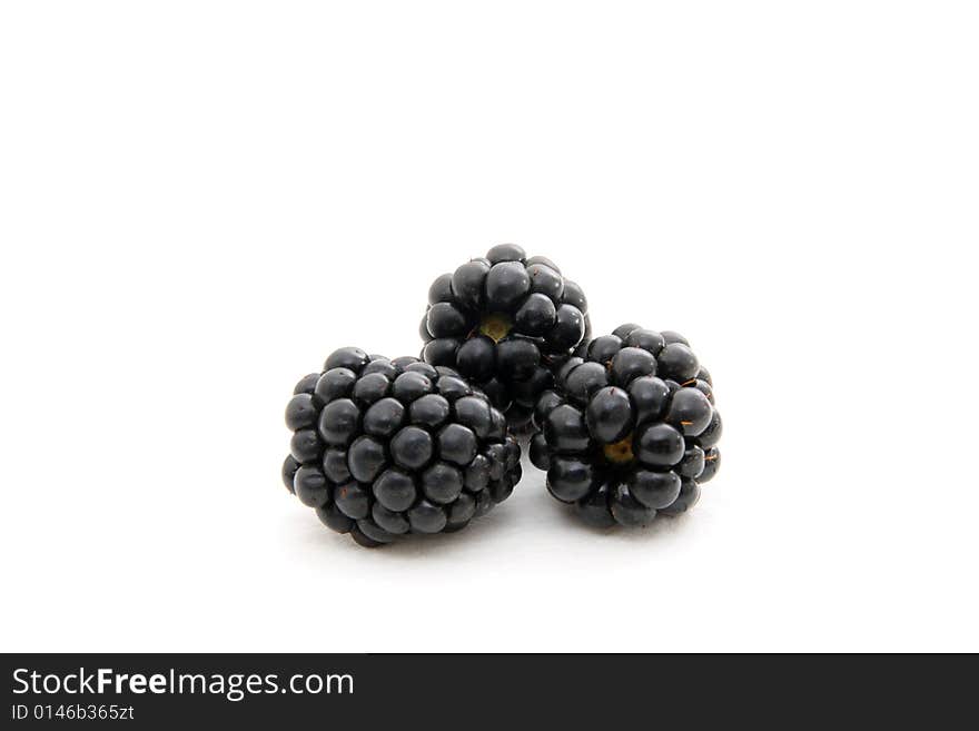 Group of plump, juicy blackberries ready to eat, isolated on white. Group of plump, juicy blackberries ready to eat, isolated on white