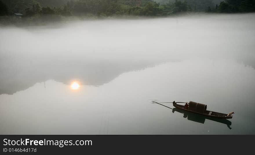 Picture is of a Foggy morning along Lost River,one dog in small craft.