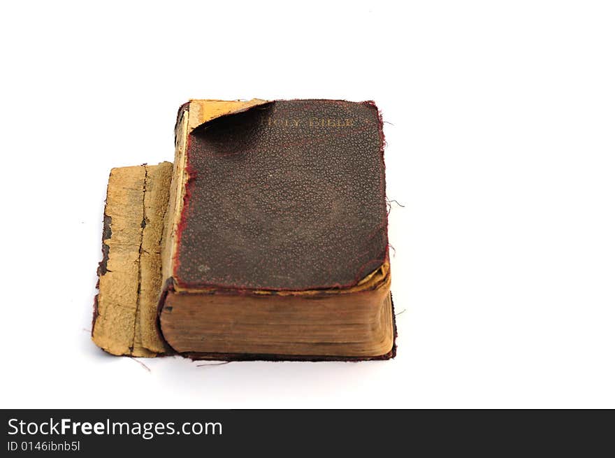 Shot of a very old and much used bible on white. Shot of a very old and much used bible on white