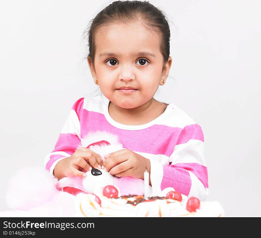 Girl with pink top and cake. Girl with pink top and cake