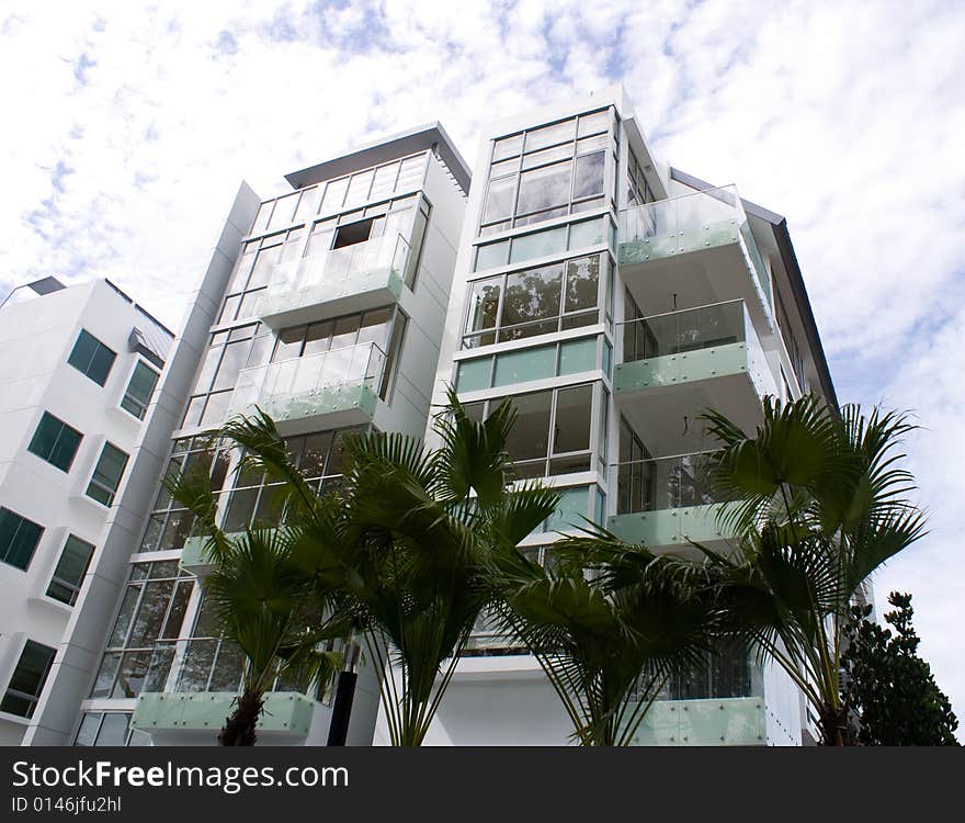 New tropical house exterior against blue sky. New tropical house exterior against blue sky