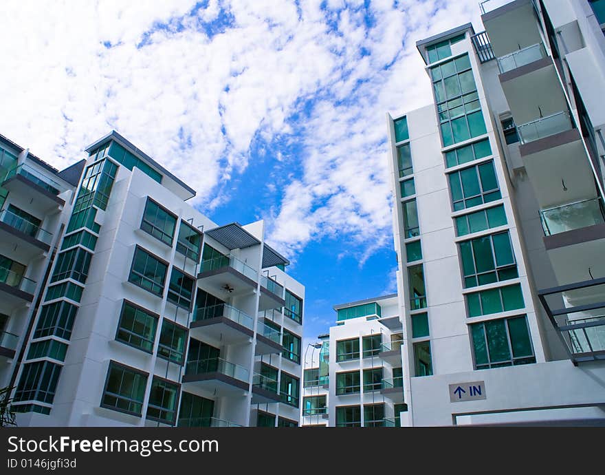 New tropical house exterior against blue sky. New tropical house exterior against blue sky